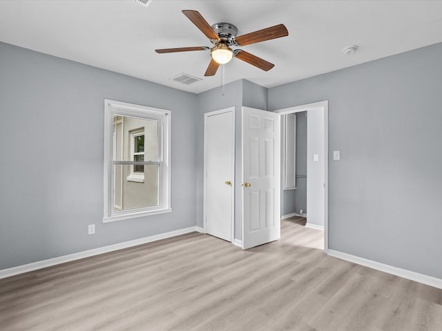 unfurnished bedroom featuring light wood-type flooring and ceiling fan