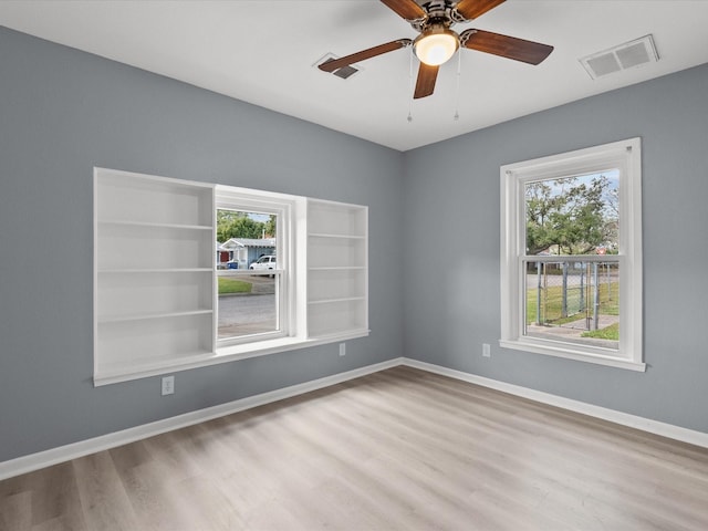 unfurnished room with light hardwood / wood-style floors and ceiling fan