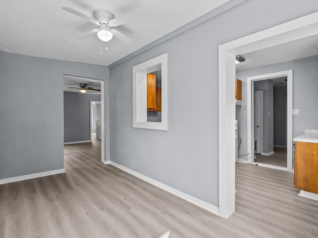 spare room with ceiling fan and light hardwood / wood-style floors