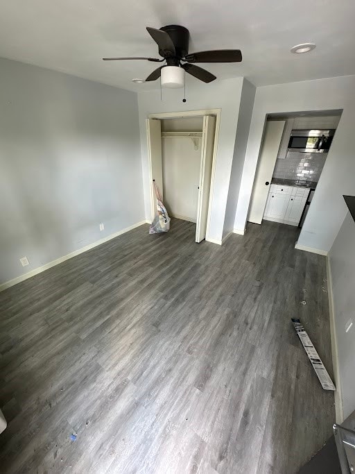 unfurnished living room with dark hardwood / wood-style floors