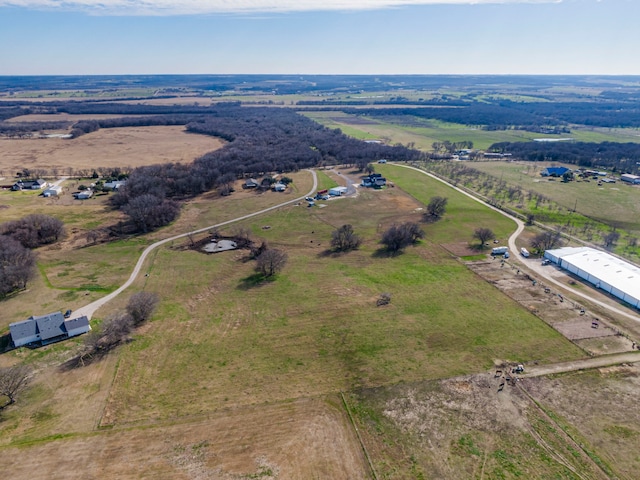 birds eye view of property with a rural view