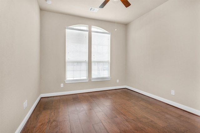 empty room with ceiling fan, hardwood / wood-style floors, and plenty of natural light