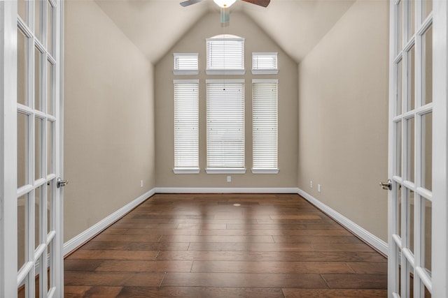 spare room featuring ceiling fan, french doors, dark hardwood / wood-style floors, and lofted ceiling