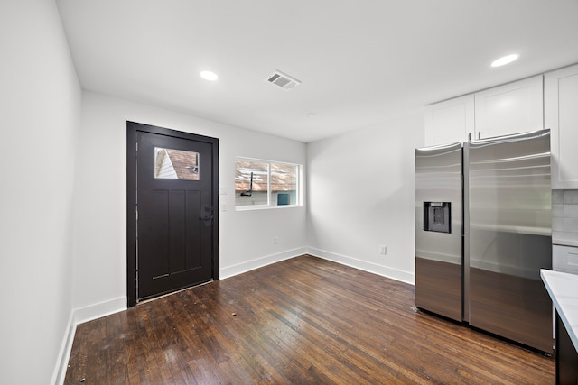 entryway with dark hardwood / wood-style floors