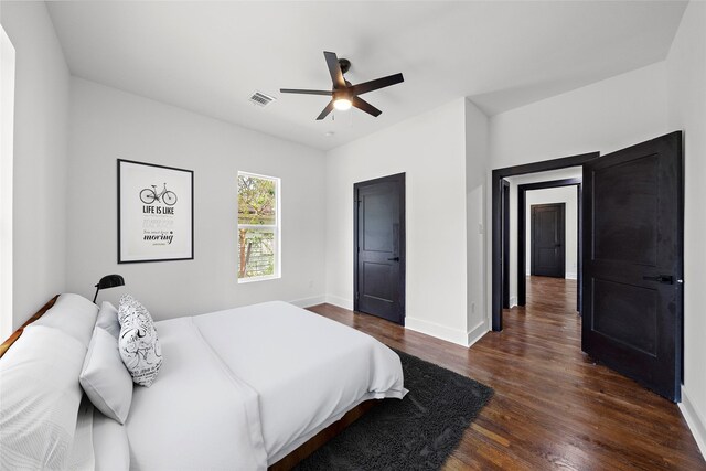 bedroom featuring dark wood-type flooring and ceiling fan