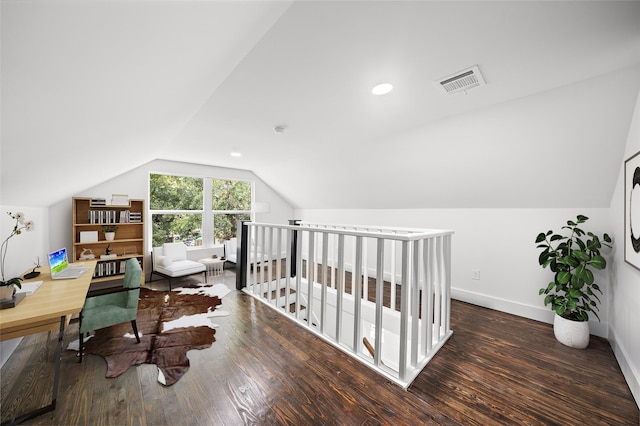 bedroom with dark hardwood / wood-style floors and lofted ceiling