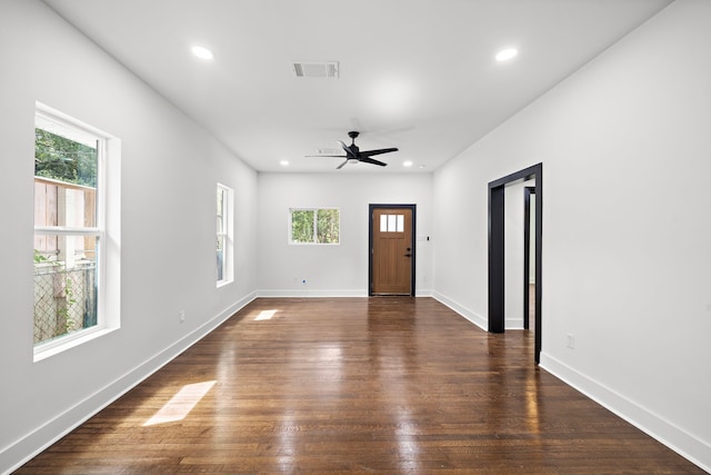 foyer with plenty of natural light, dark wood-type flooring, and ceiling fan