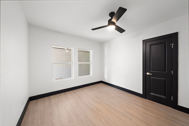 spare room with ceiling fan and light hardwood / wood-style flooring