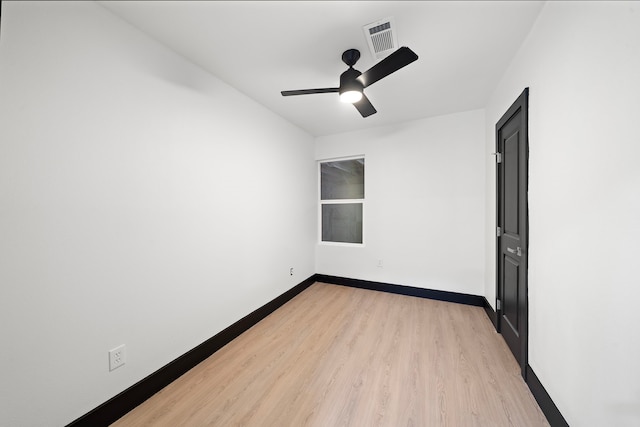 spare room featuring ceiling fan and light hardwood / wood-style flooring