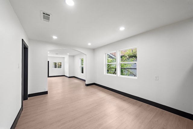 spare room with light hardwood / wood-style floors