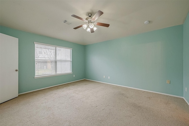 unfurnished room with ceiling fan and carpet floors