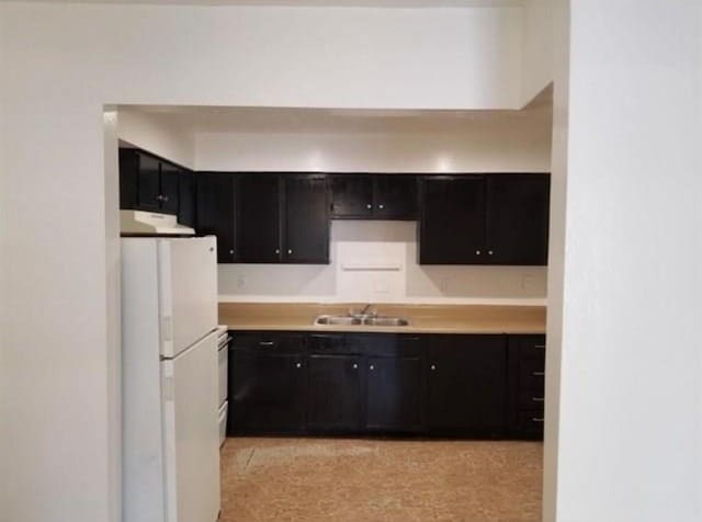 kitchen featuring sink and white refrigerator