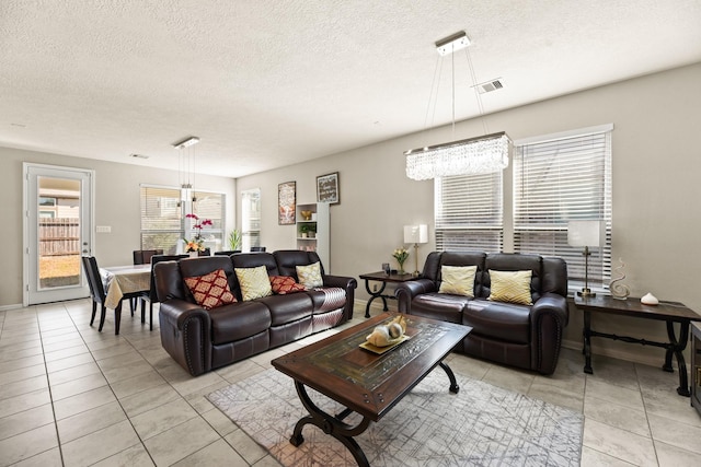 tiled living room with a textured ceiling