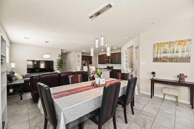 dining area featuring light tile patterned flooring