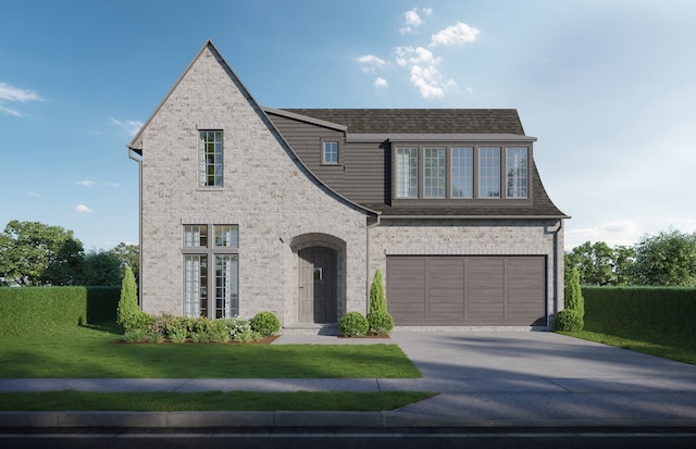 view of front facade with a garage and a front lawn