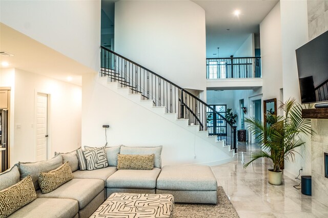 living room with a towering ceiling