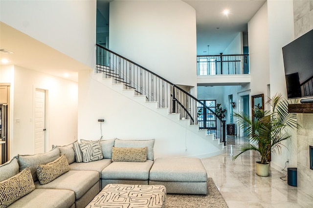 living room with a towering ceiling