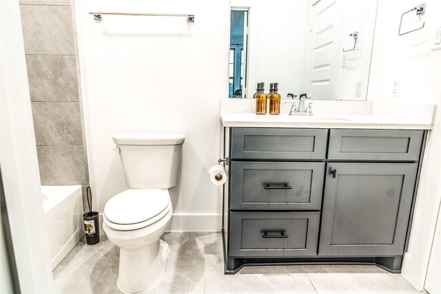 full bathroom with vanity, toilet, tile patterned floors, and shower / tub combination