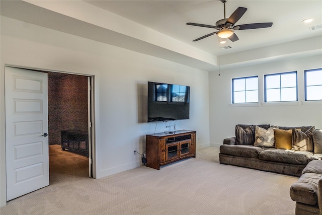 living room with light carpet and ceiling fan