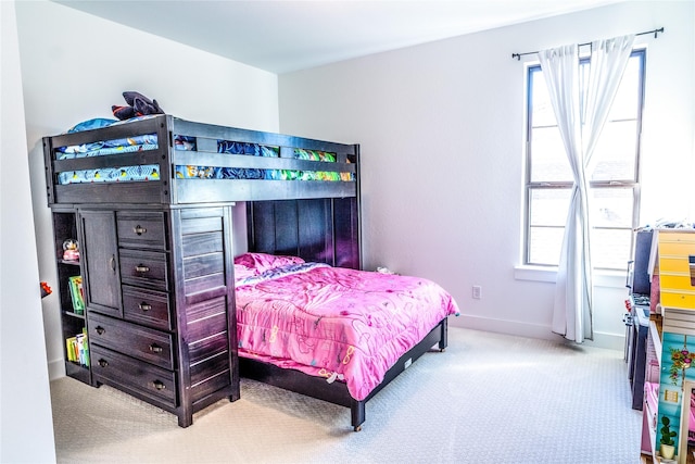 bedroom featuring light colored carpet