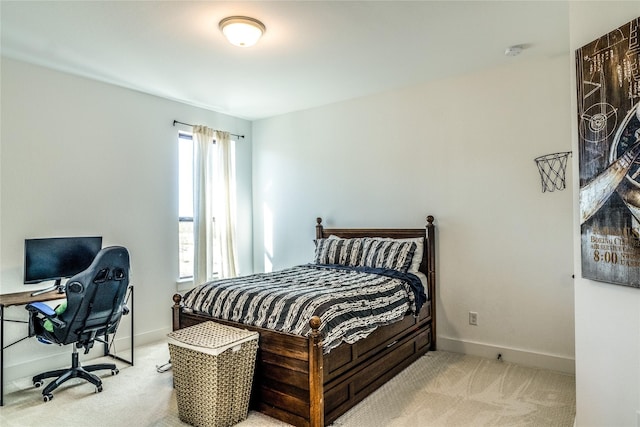 bedroom featuring light carpet