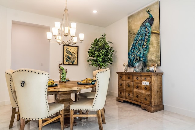 dining space with an inviting chandelier