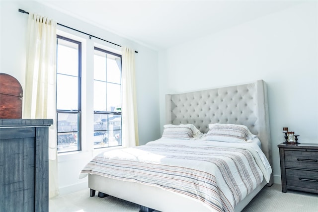 bedroom with light colored carpet