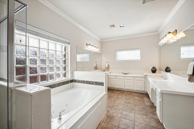 bathroom featuring crown molding, a healthy amount of sunlight, a bath, and vanity