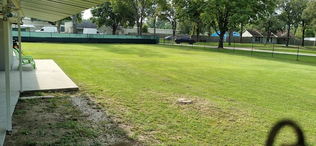 view of yard featuring a patio area and fence