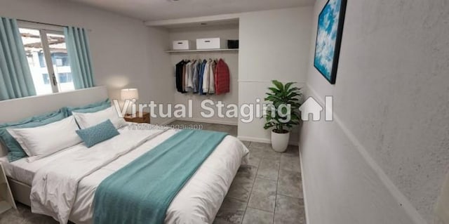 bedroom with light tile patterned floors