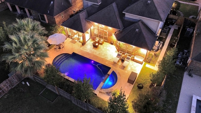 view of swimming pool featuring a patio area and an outdoor fire pit