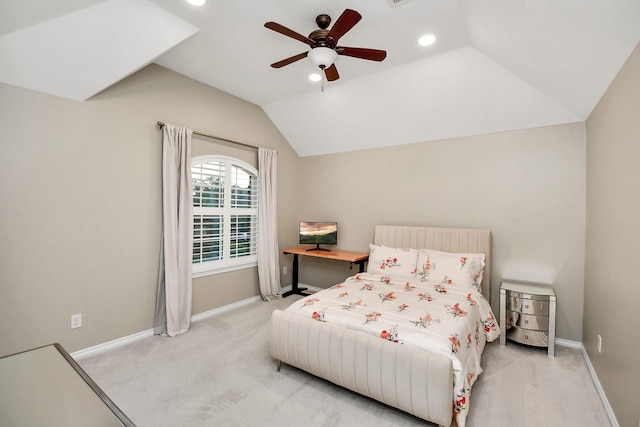 carpeted bedroom with vaulted ceiling and ceiling fan