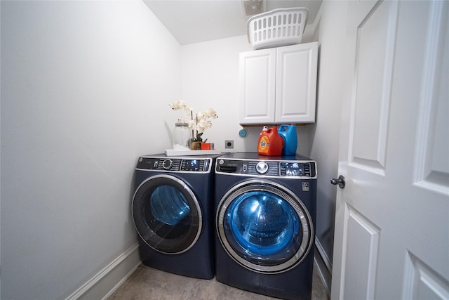 laundry area with cabinets and independent washer and dryer