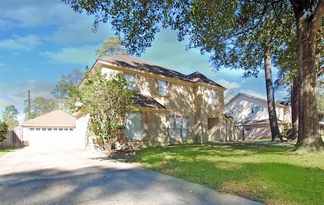 view of front of property featuring a garage and a front yard