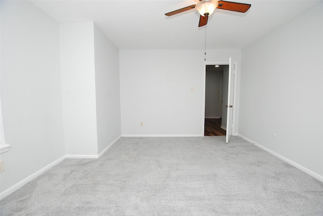 unfurnished room with light carpet and ceiling fan