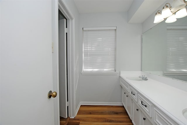 bathroom featuring vanity and hardwood / wood-style flooring