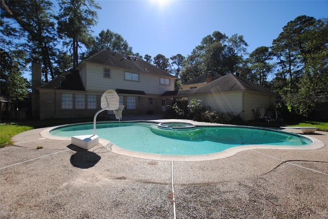 view of swimming pool with an in ground hot tub, a diving board, and a patio