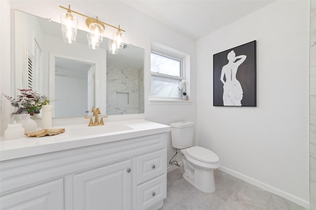 bathroom with toilet and vanity