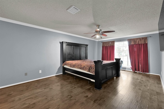 bedroom with a textured ceiling, dark hardwood / wood-style floors, ceiling fan, and ornamental molding