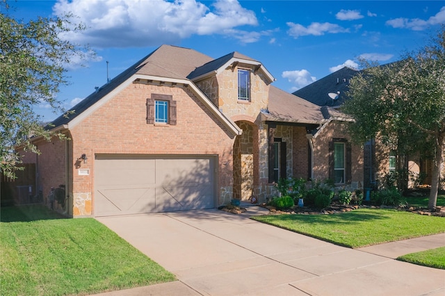 view of front facade featuring a garage and a front lawn