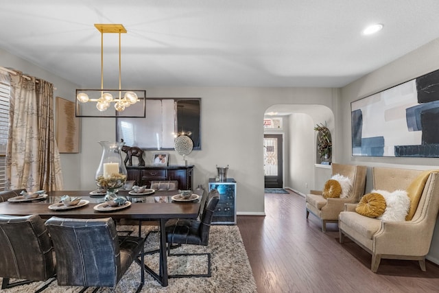 dining space with dark hardwood / wood-style flooring