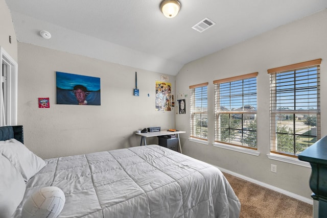 carpeted bedroom featuring vaulted ceiling