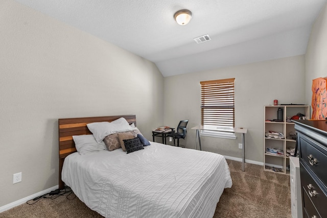 carpeted bedroom with lofted ceiling