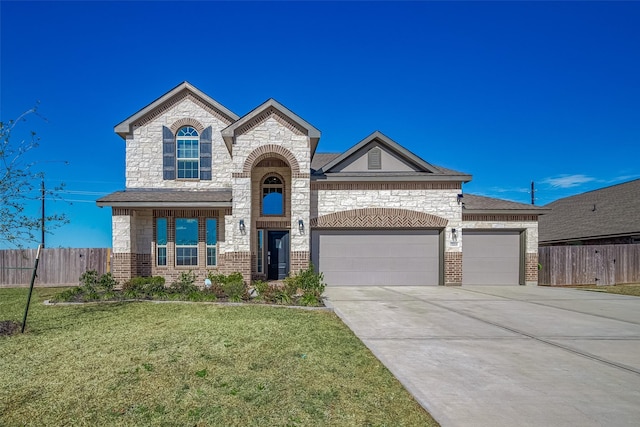 view of front of property with a front yard and a garage