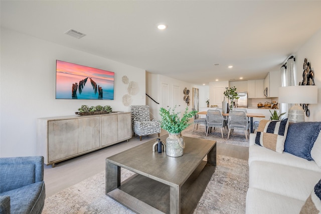 living room with light hardwood / wood-style floors