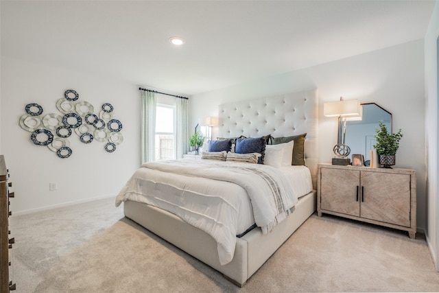 bedroom featuring light carpet