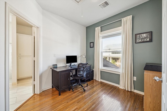 office with hardwood / wood-style flooring