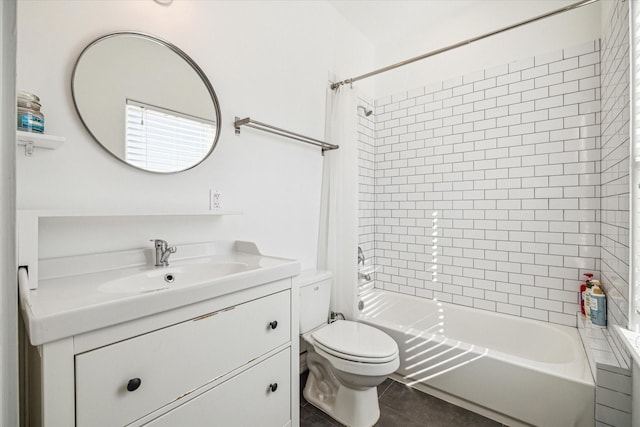 full bathroom featuring tiled shower / bath combo, vanity, tile patterned floors, and toilet