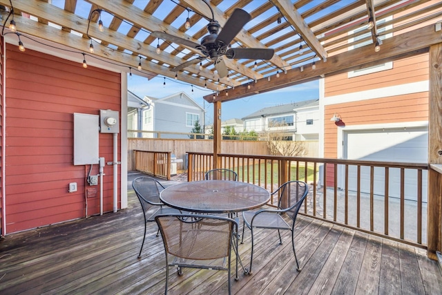 wooden terrace featuring ceiling fan and a pergola