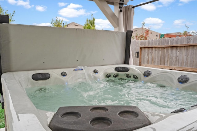 exterior details featuring a hot tub